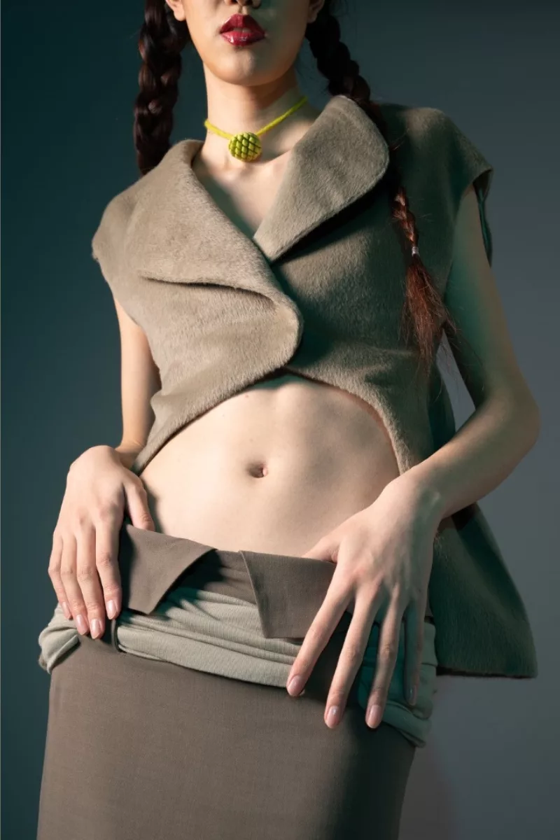 A model wearing a closeup of furry vest from Wenxin’s BFA thesis collection from Parsons fashion school